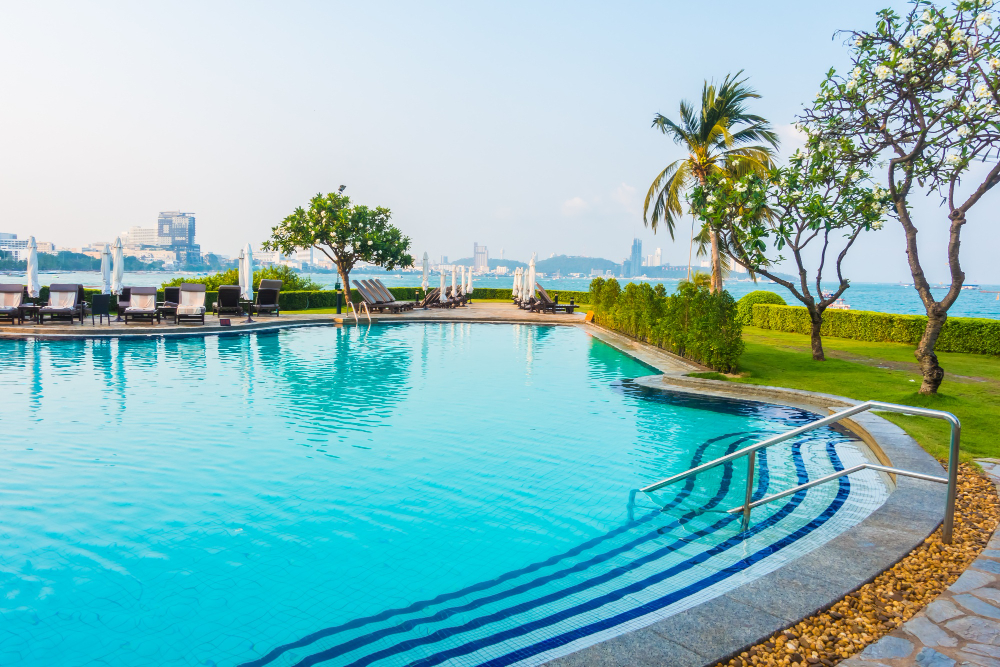 Resort swimming pool with city skyline view