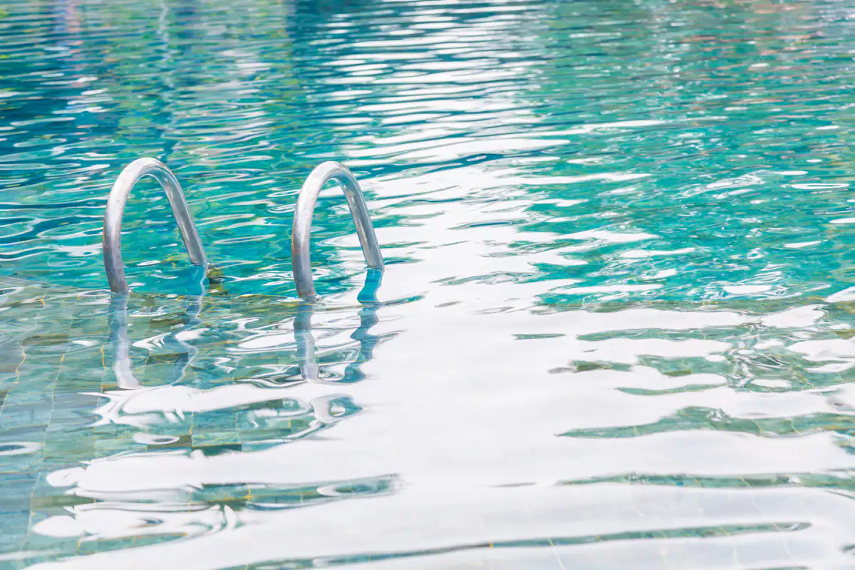 Clean above ground pool with ladder and steps after professional cleaning service